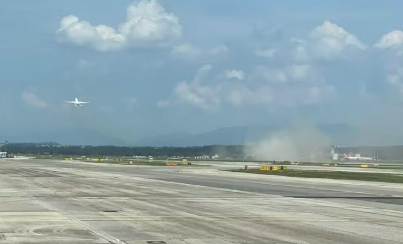 Fumaça indicando impacto da aeronave no chão ao decolar