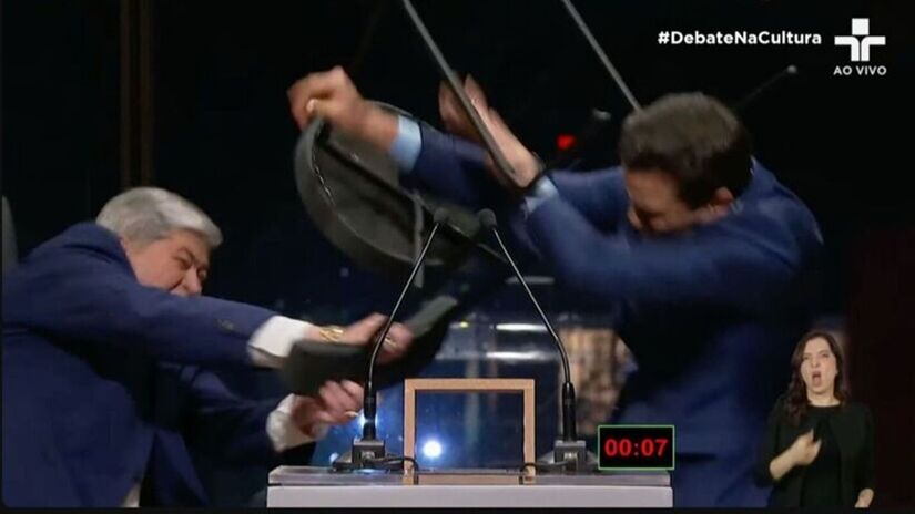 Candidato levou uma cadeirada de Datena durante debate na TV Cultura/Reprodução