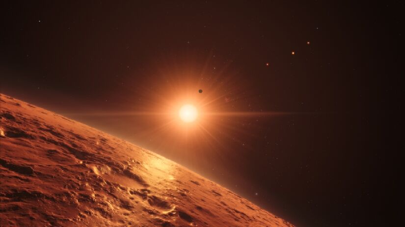 Essa é uma representação artística da visão da estrela TRAPPIST-1 de perto da superfície do TRAPPIST-1e. Imagem: ESO/N. Bartmann/spaceengine.org