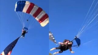Paraquedista cai sobre tenda após bandeira gigante dos EUA ficar presa em árvore durante rodeio