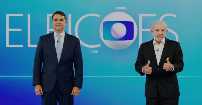 Lula e Flávio Bolsonaro se enfrentam no último debate antes das eleições de domingo / Divulgação/TV Globo