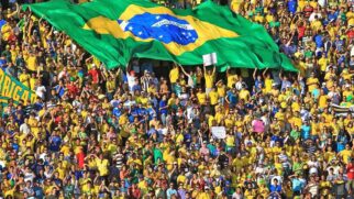 Levantamento mostra que duas das primeiras cidades que receberão jogos da Seleção Brasileira já registram aumento significativo nos preços